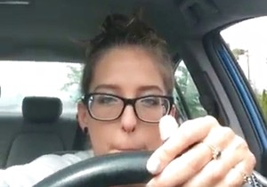 Pretty mature feet showcased in a parked car