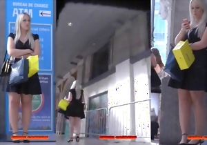 Spicy babe in a black dress filmed on the hidden cam